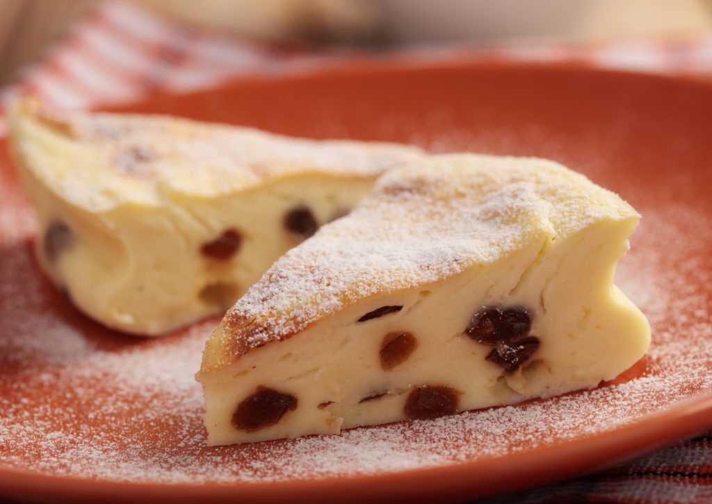 In Poland, families on Christmas traditionally eat Sernik. The cheese cake is served with or without raisins. The kids also hope to find a coin under their plate. And the gifts aren’t unwrapped until after dinner.