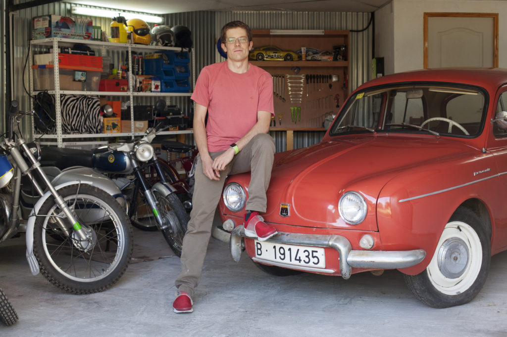 Daniel Quesada, Graphic Designer at NORMA Group, with his Renault Dauphine at his garage.