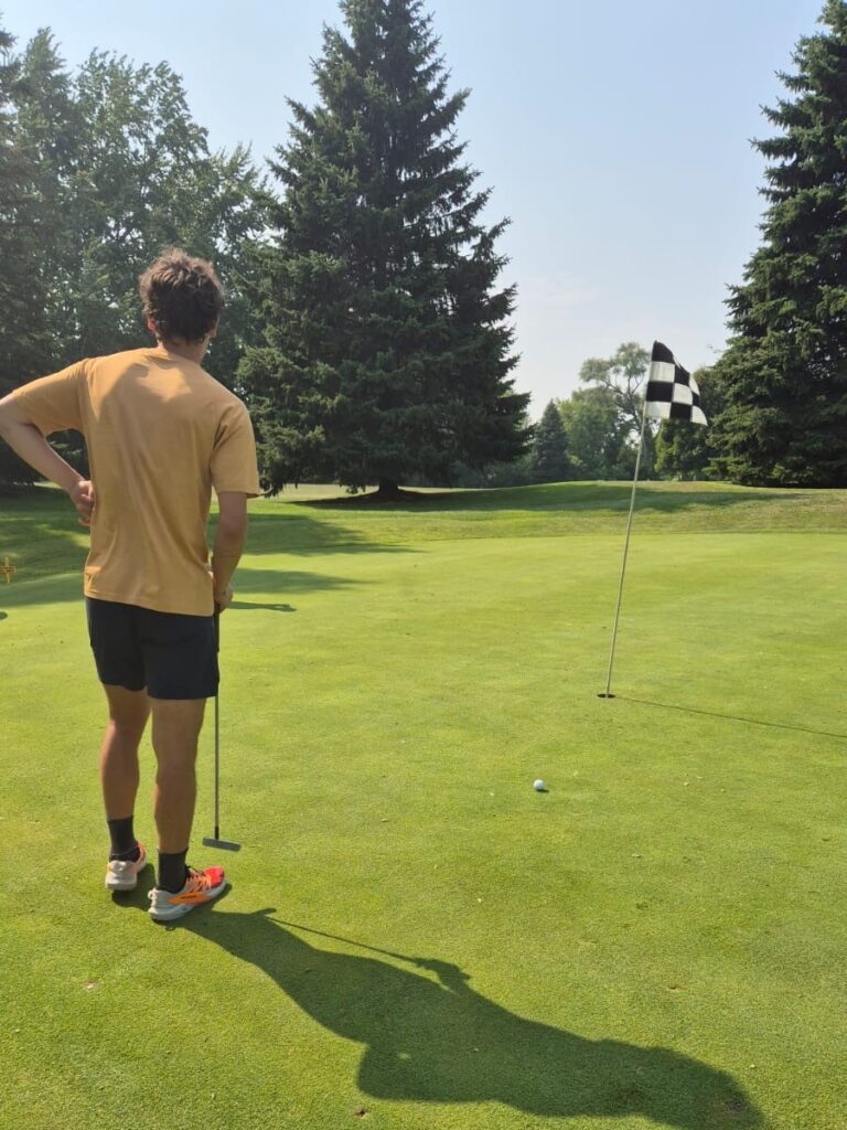 Image of Clement Briand playing golf